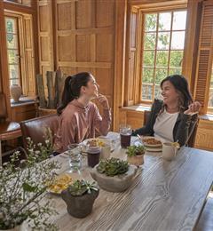 mother and daughter eating breakfast