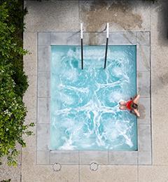 Woman relaxing in a pool