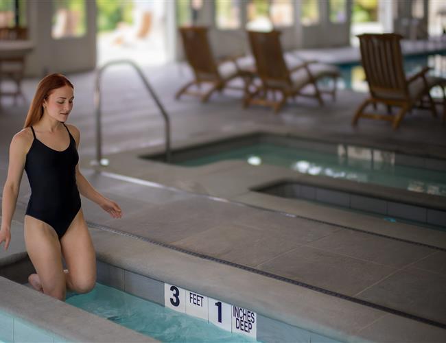 Woman getting into a cold plunge