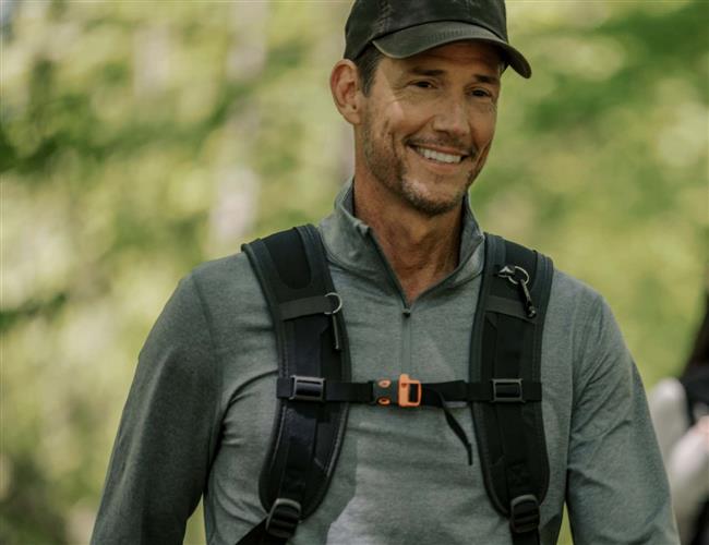 Man hiking with a smile