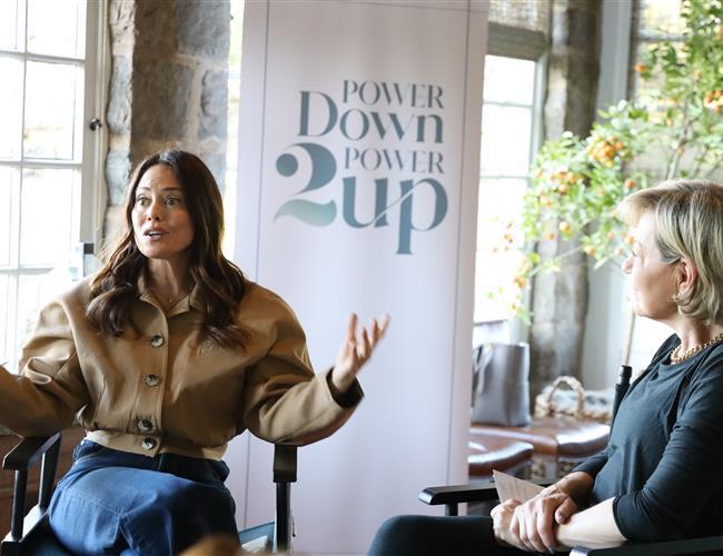 a woman speaking at a corporate buyout of the ranch