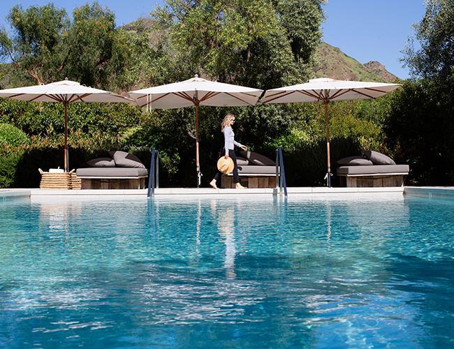 Woman walking near a pool