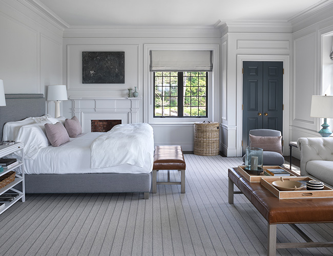 Bedroom view with modern yet cozy furnishings and ample natural lighting