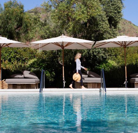 woman walking by the pool