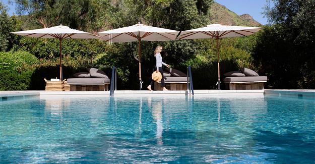 Woman walking by pool