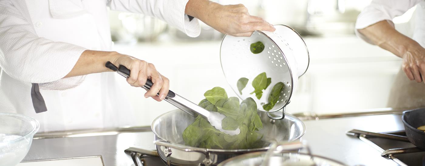 chef cooking spinach 