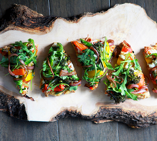 Pizza slices with tons of fresh veggies