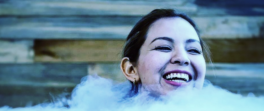 A woman smiling in the sauna