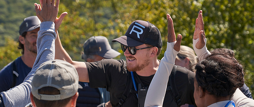 Joy of summer camp hikers high fiving