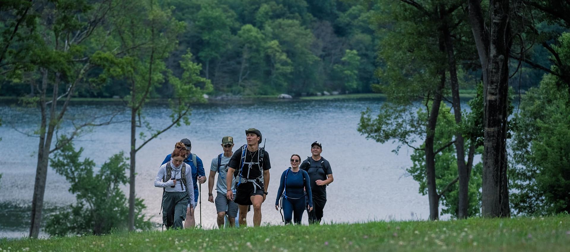 group of hikers by a lake