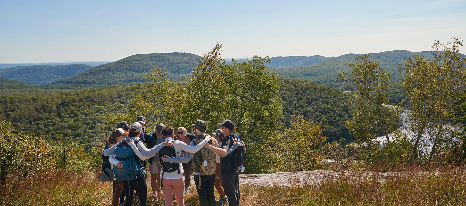 Group of people standing in a beautiful landscape